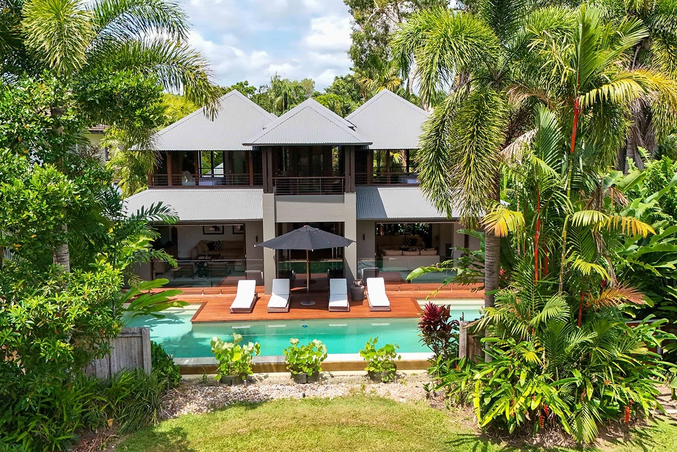 The residence, nestled within its gardens