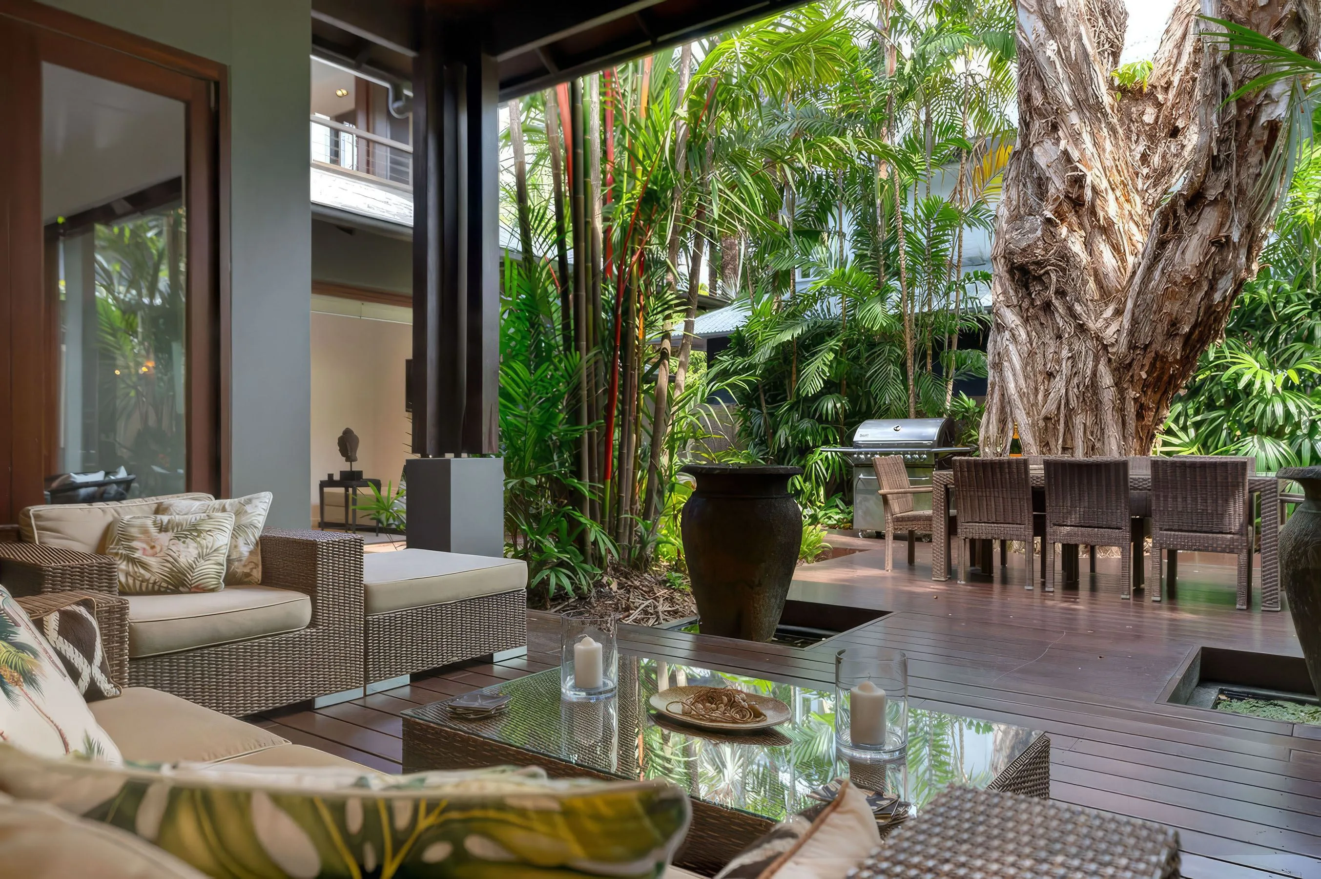 The sheltered outdoor lounge overlooking the tropical garden