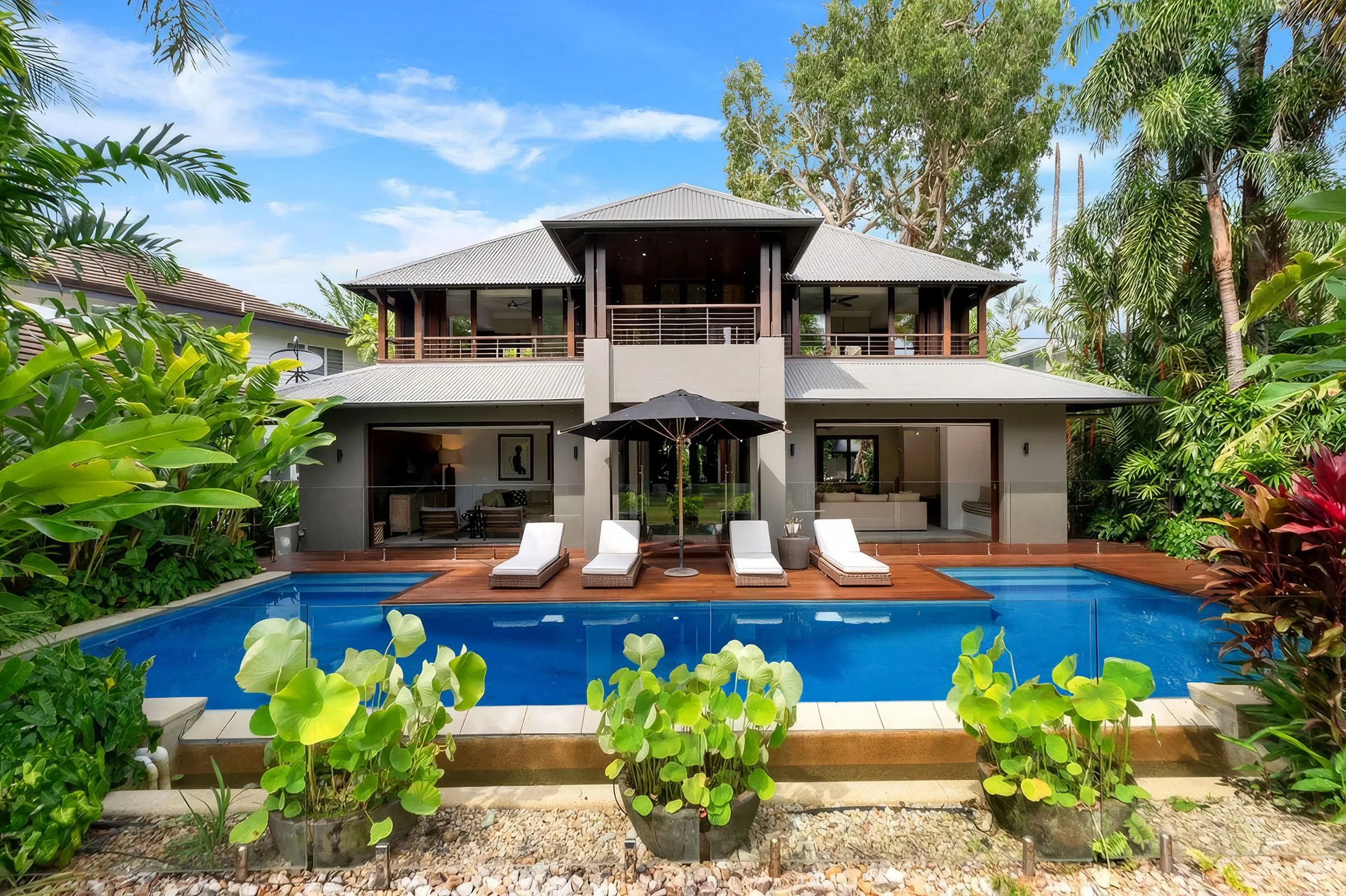 Villa Omaroo and its infinity pool, surrounded by tropical gardens